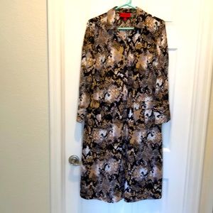 Jennifer Lopez snake, print dress, or tunic style top